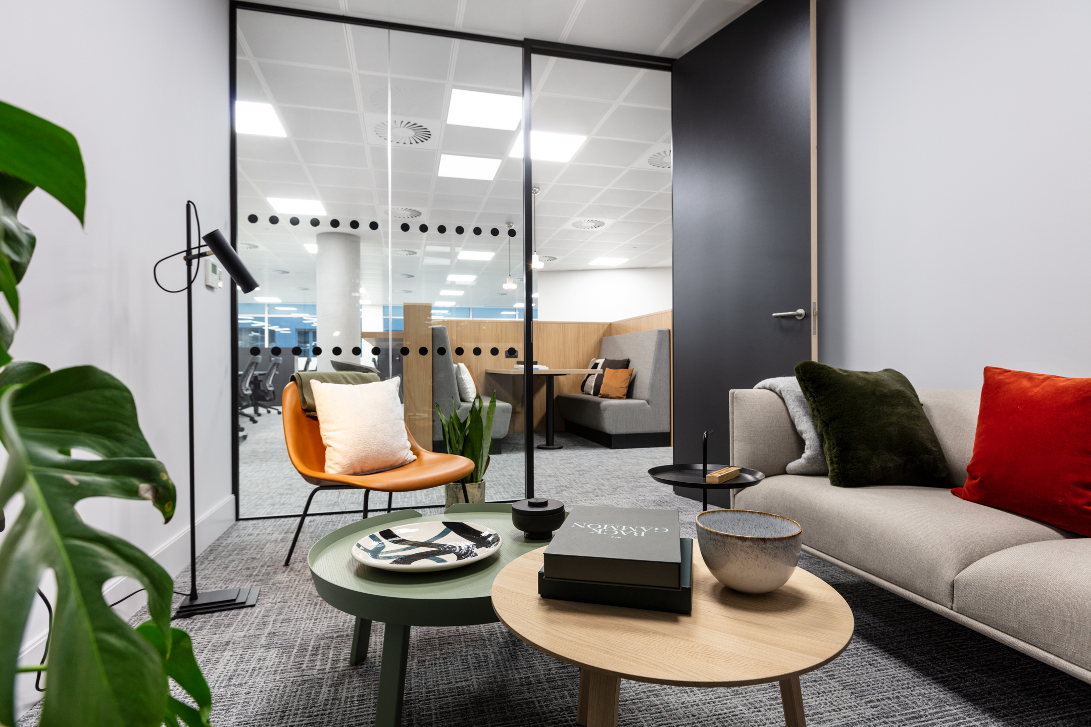 7 Bishops Gate, Level 3 06 meeting room featuring biophilic plants, glass wall and a coffee table.