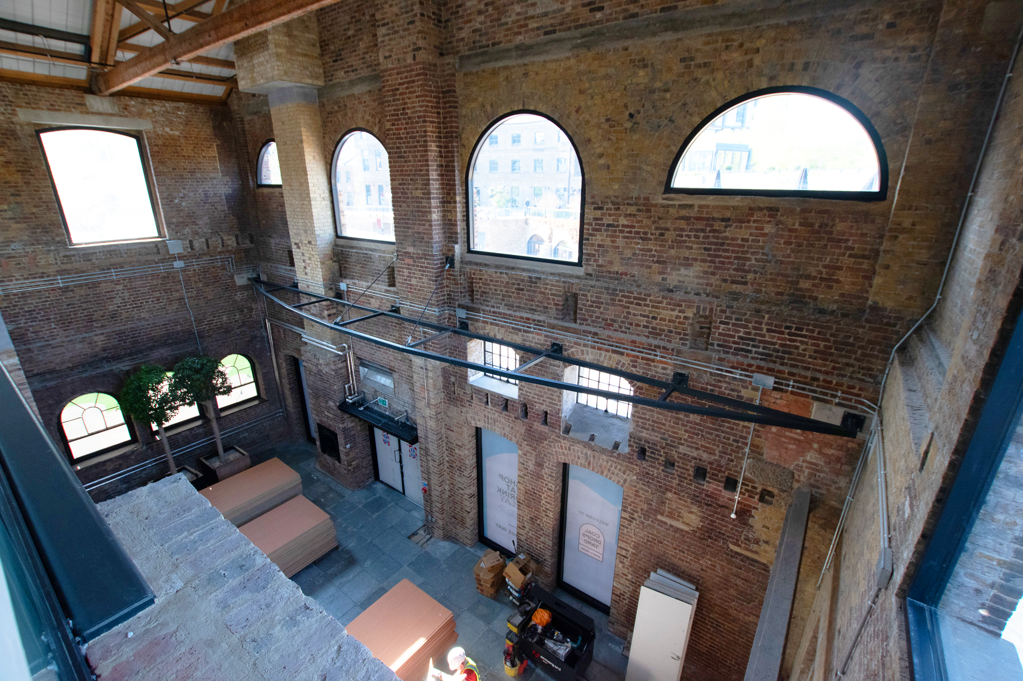 Second floor view at Coal Drops Yard with large windows and infrastructure