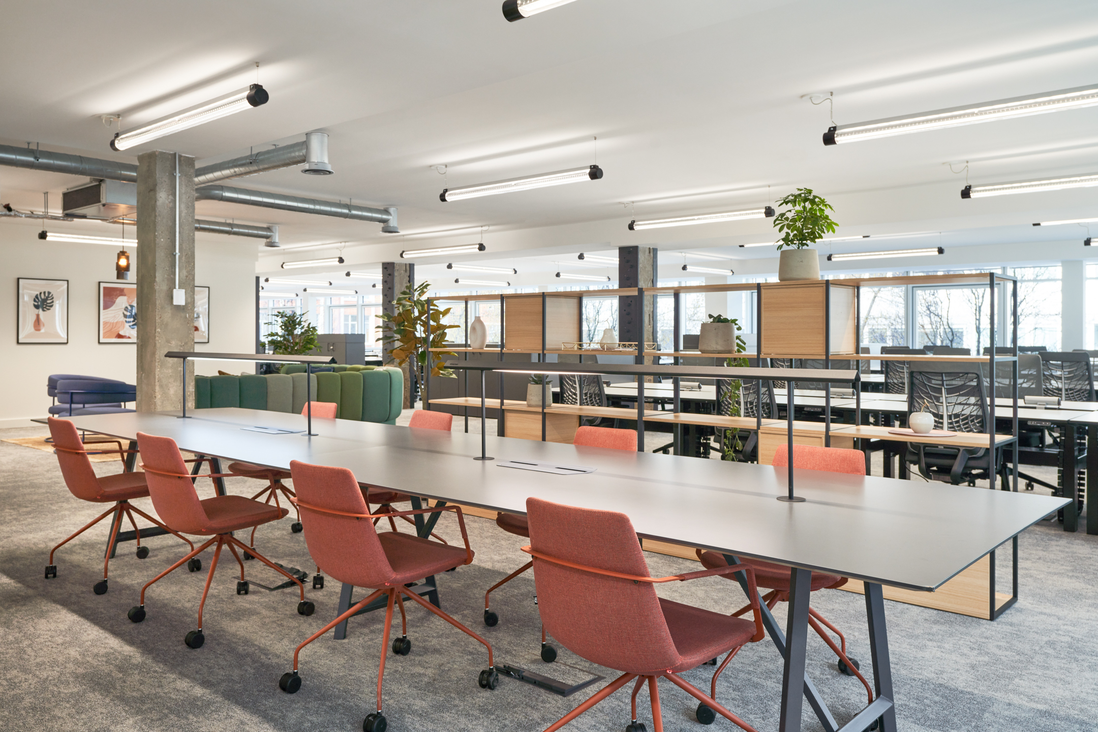 Open-plan office space at 101 New Cavendish Street, L2, with long desks, orange chairs, and plenty of natural light.