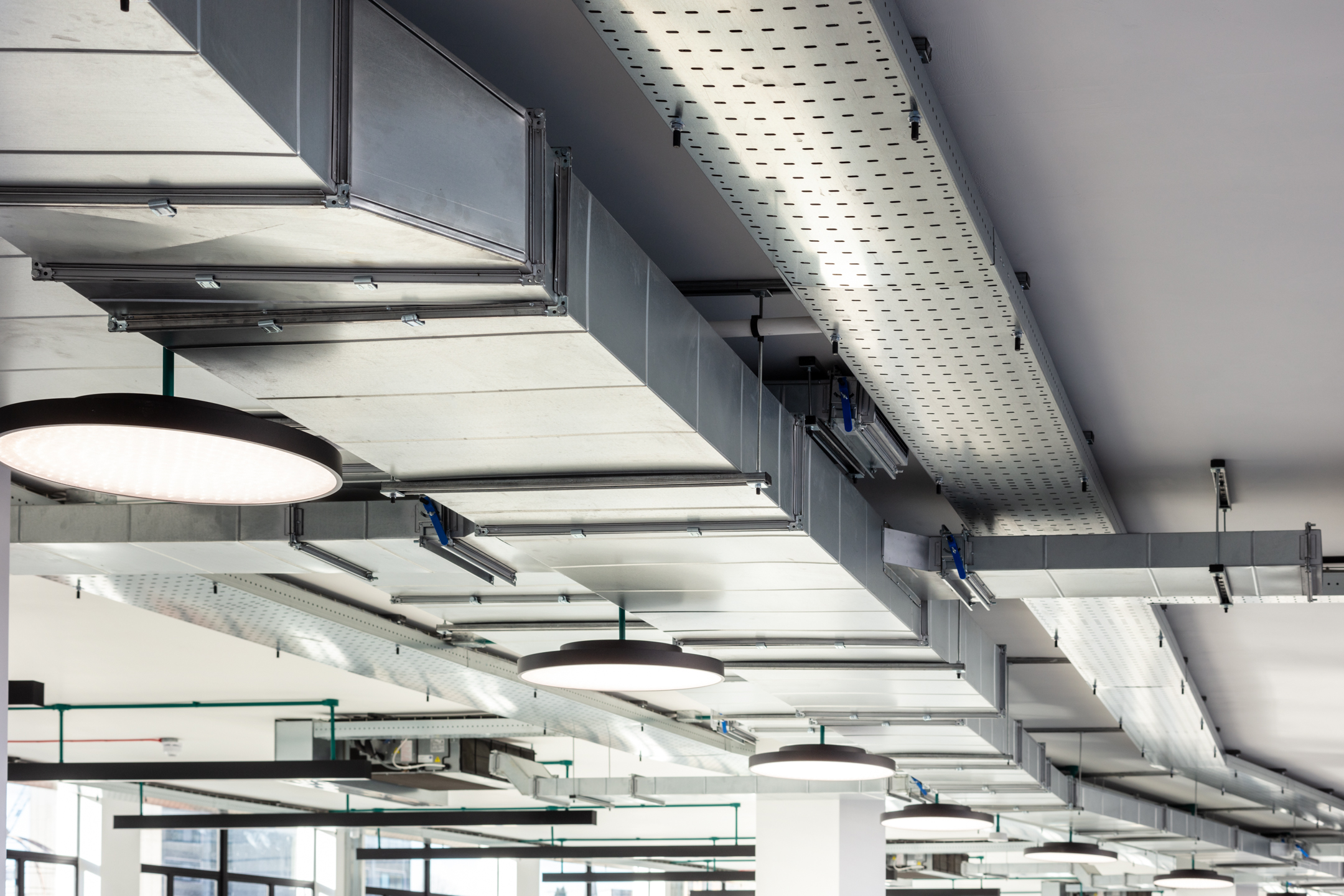 Technical Services exposed fan ducts on the ceiling