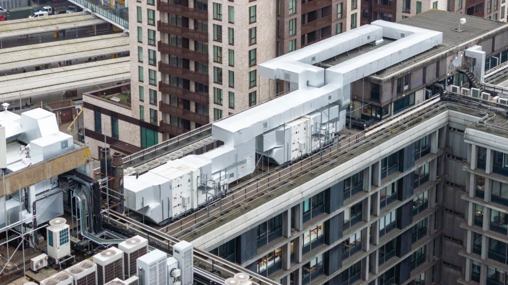 An aerial shot capturing the complex MEP refurbishment at Mosaic East, including upgraded HVAC systems and electrical infrastructure.