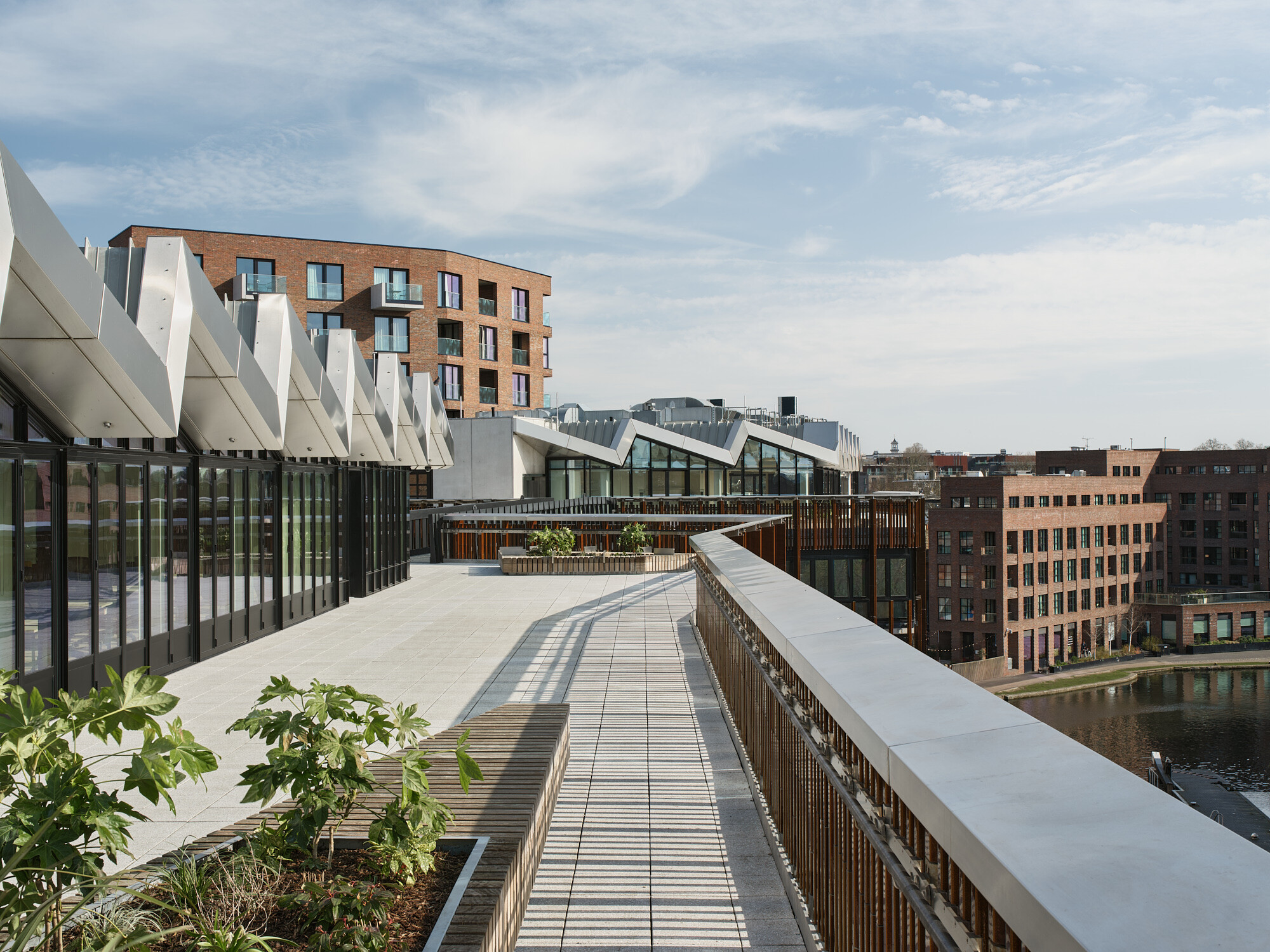 Rooftop terrace at Labtech’s Hawley Wharf development, overlooking Regent’s Canal with landscaped planters and angular zinc cladding detail.