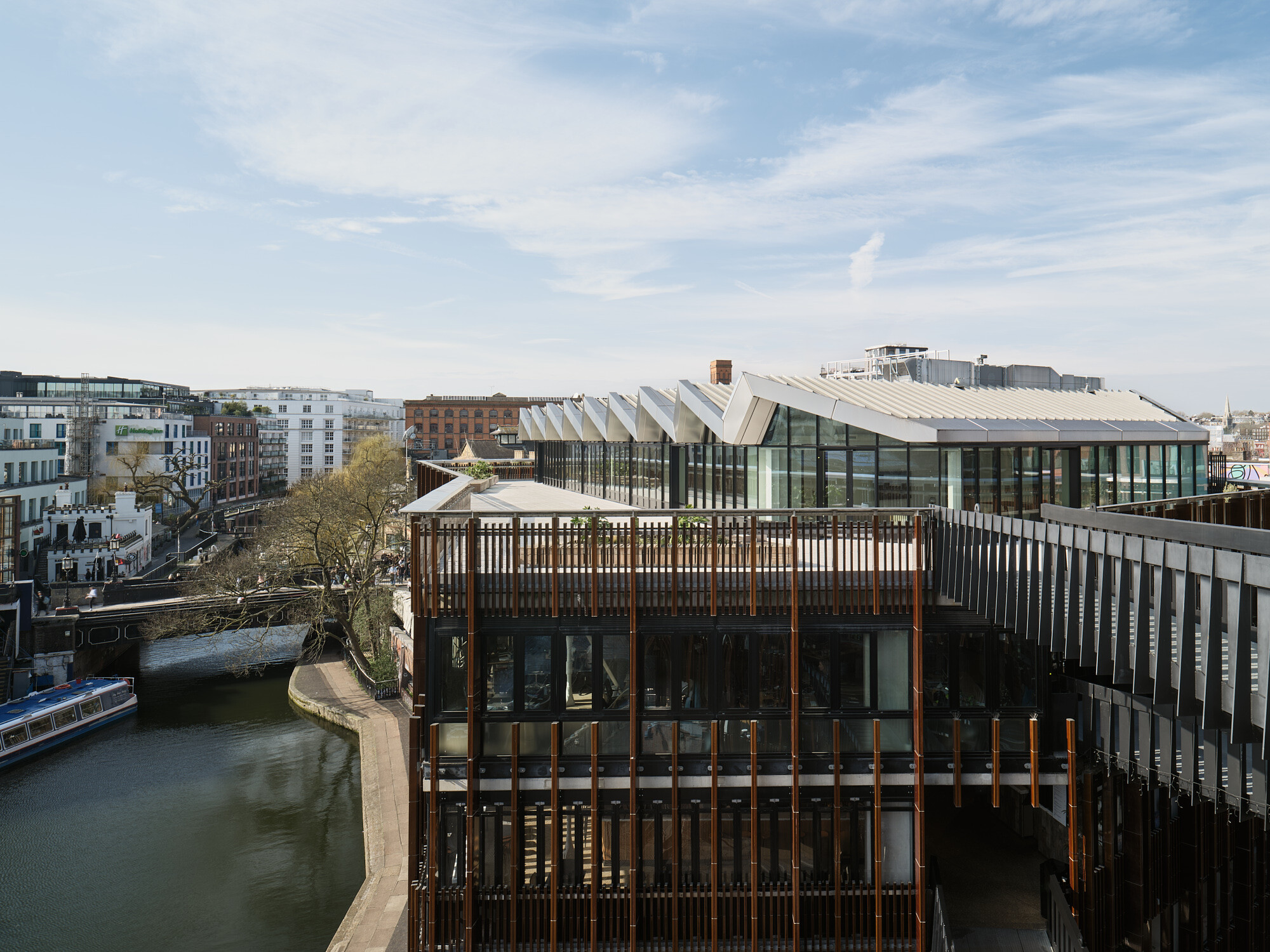 View across Regent’s Canal towards Labtech’s Hawley Wharf, showcasing angular rooflines, canal-side pathways, and the vibrant Camden streetscape.