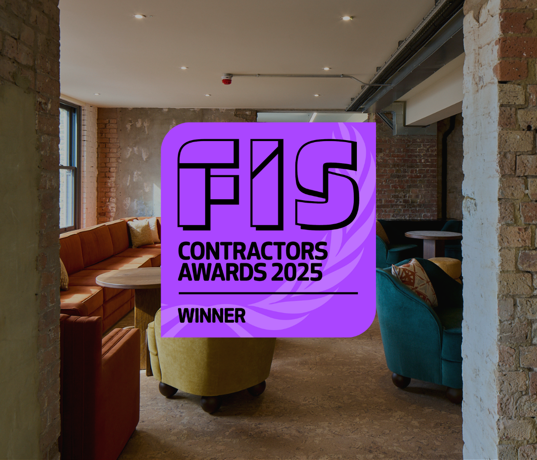 The Waterman project wins Most Sustainable Project at the FIS Contractors Awards 2025. A badge with the FIS logo and 'Winner' text overlays an exposed-brick breakout space with velvet seating.
