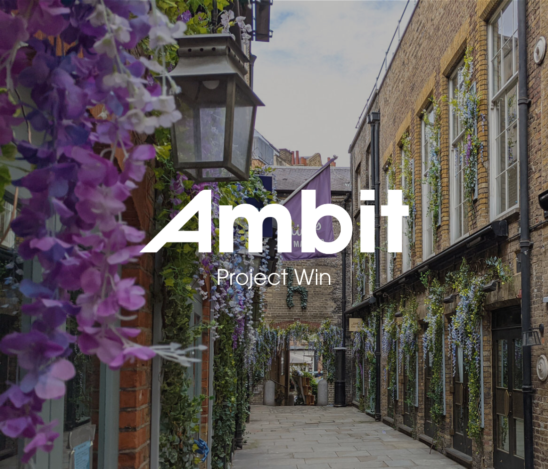 Lancashire Court in Mayfair, a historic courtyard with floral-covered façades and period brickwork, overlaid with Ambit's ‘Project Win’ graphic announcing the refurbishment of 4–7 Lancashire Court.